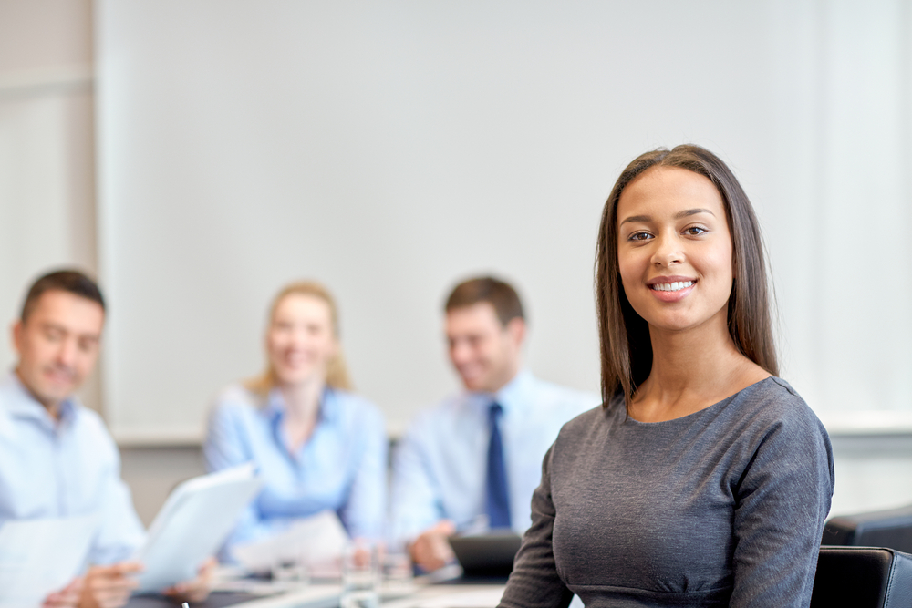 image of businesswoman and colleagues