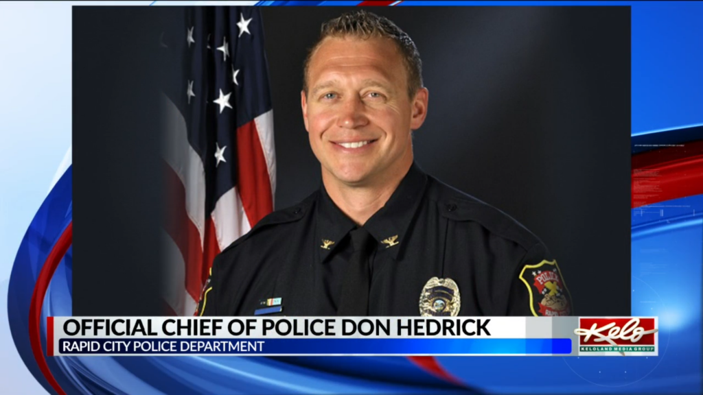 Still image from the news story announcing that NAU Associate Professor Don Hedrick has been sworn in as the Chief of Police in Rapid City, South Dakota.