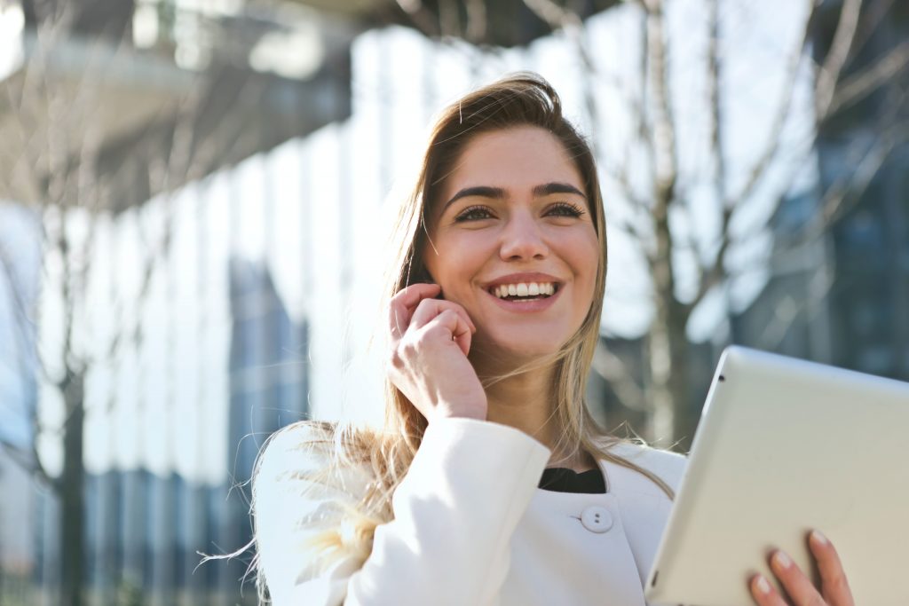 Professional woman on the phone looking confident.